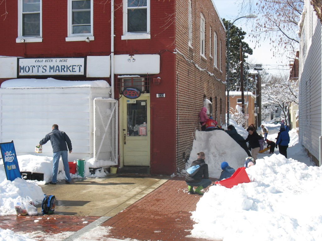 Makeshift sledding in the alley next to Mott's Market